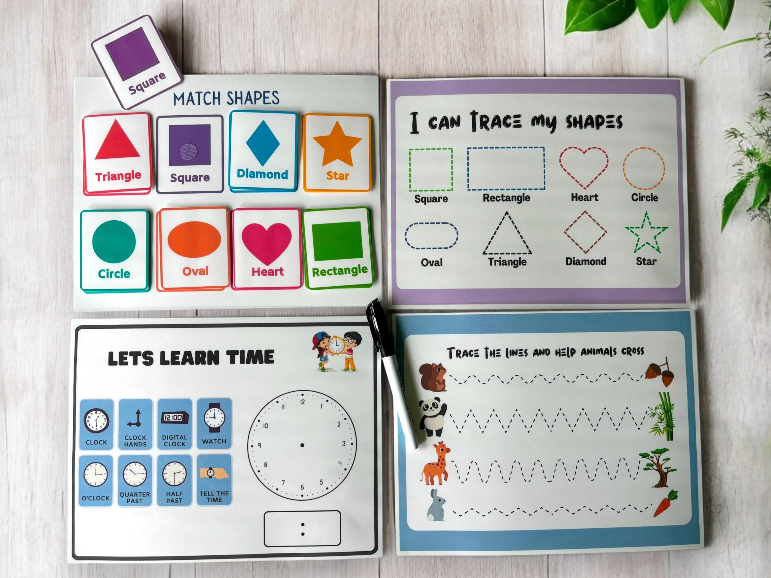 Laminated toddler tracing book with shapes, numbers and time-telling activities